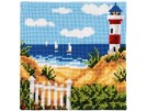 kruissteekkussen strandgezicht met vuurtoren